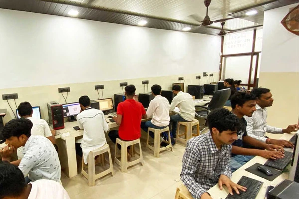 Students working at computers in a computer institute classroom