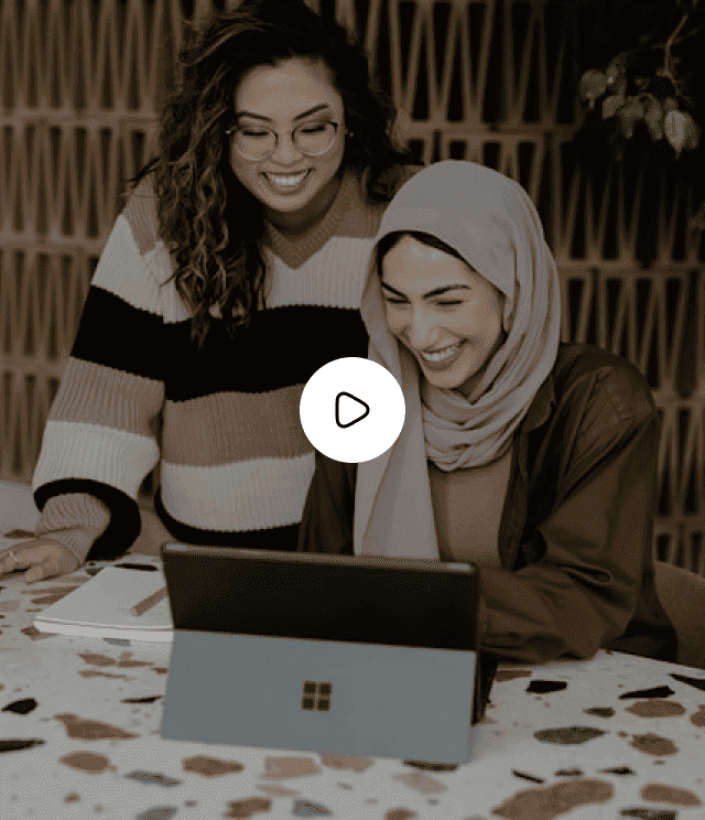 Two women smiling at a laptop, email marketing video thumbnail