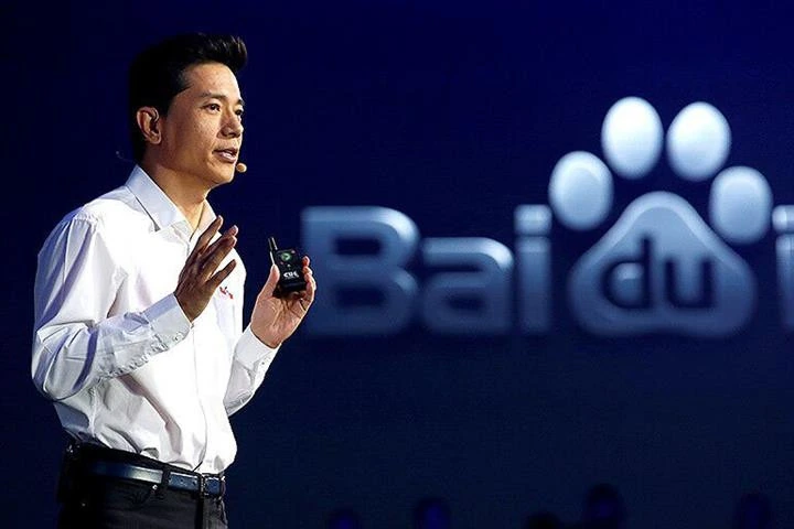 The CEO of Baidu speaking on stage in front of the Baidu logo